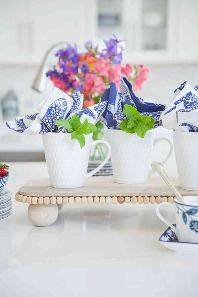 white mugs on a wooden riser