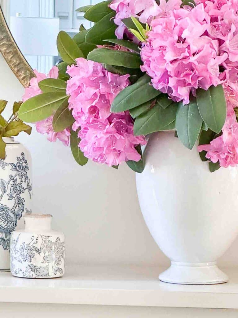 summer foyer ideas- beautiful purple flowers in a white urn