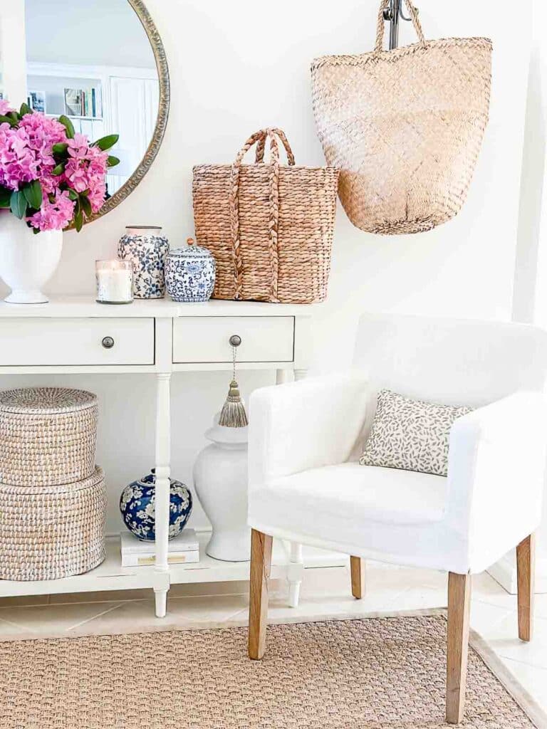 summer foyer ideas- white slipcovered chair in the summer foyer