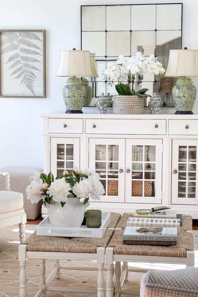 living room with flowers on the coffee table