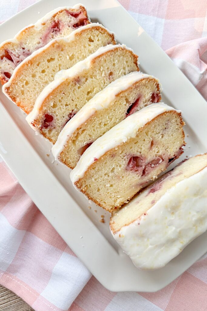 strawberry lemon loaf cake on a white plate