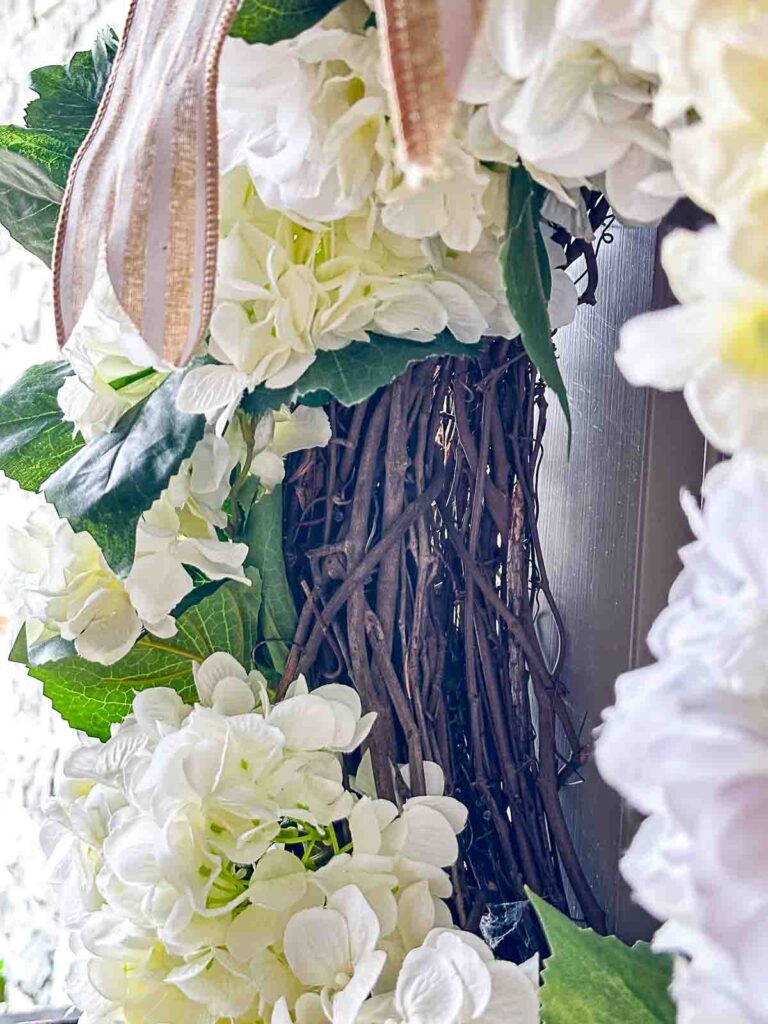 WHITE HYDRANGEA WREATH- grapevine wreath looking at the side of the hydrangea wreath