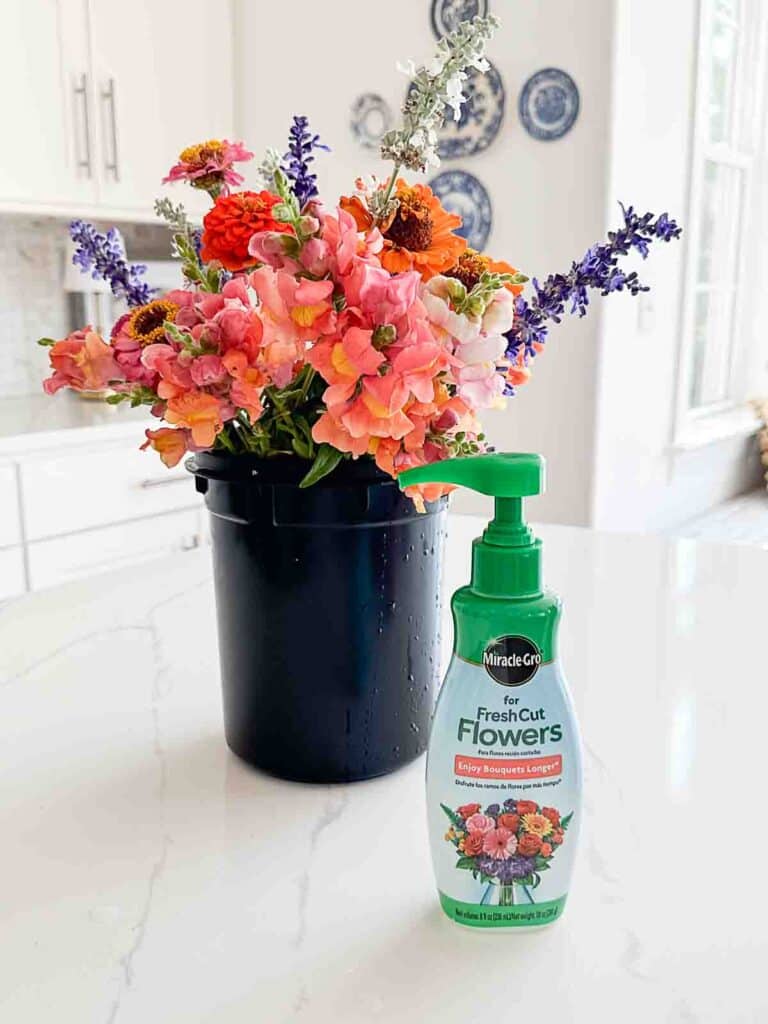 bucket of cut garden flowers with cut flower food