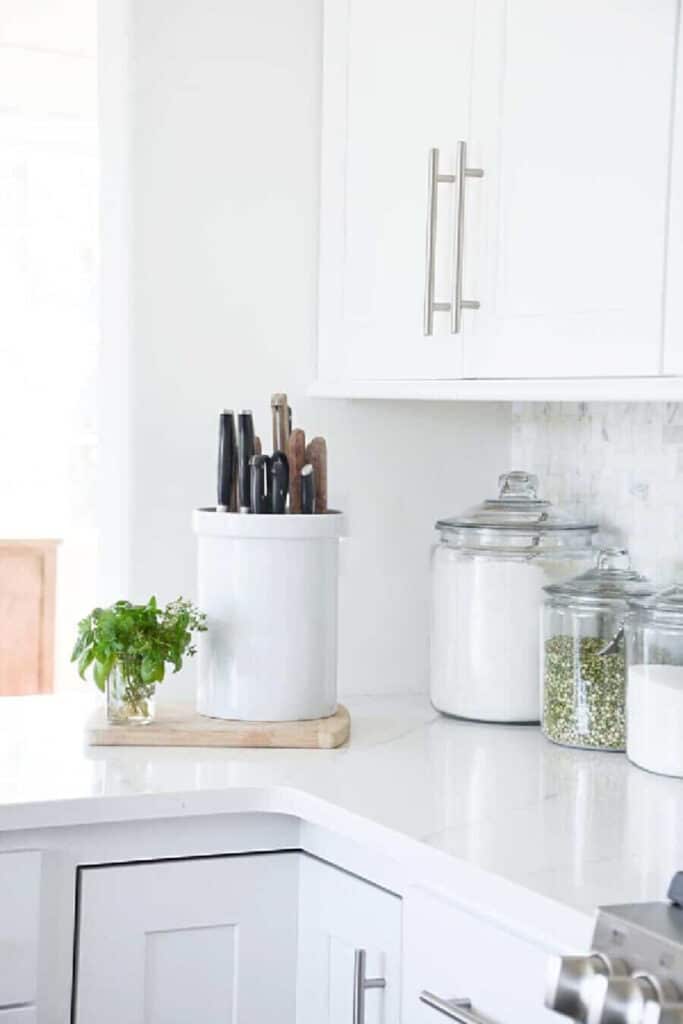 knives and glass jars on a kitchen counter