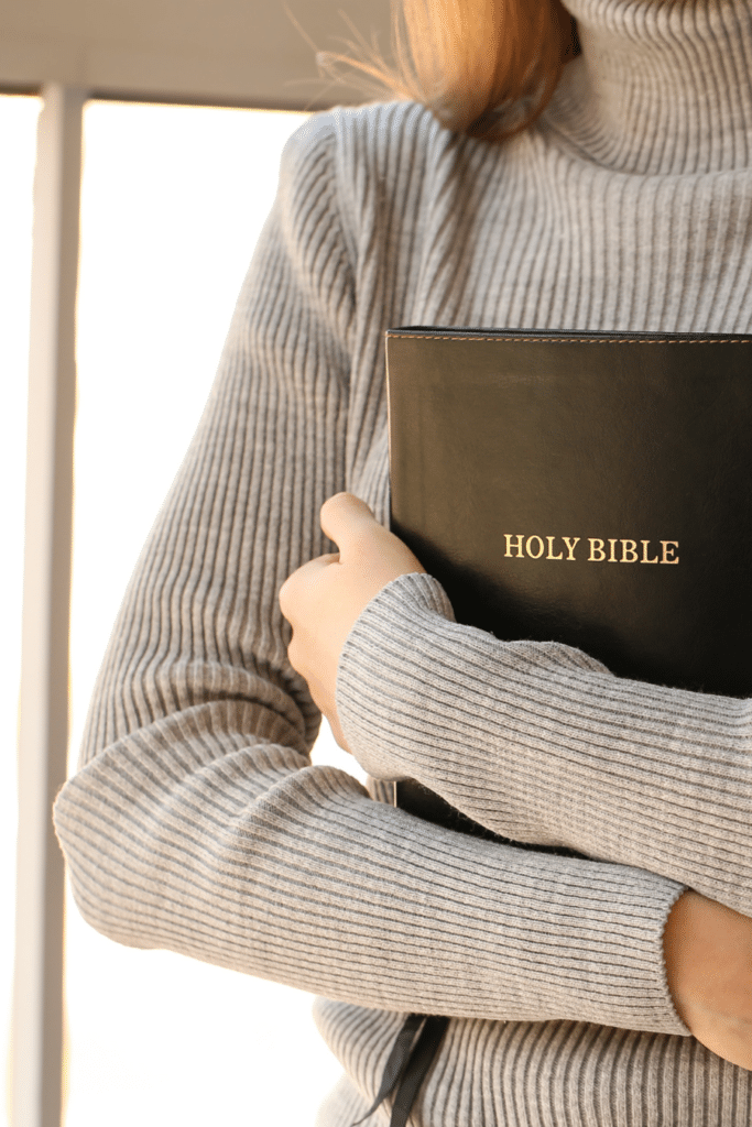 woman holding a Bible