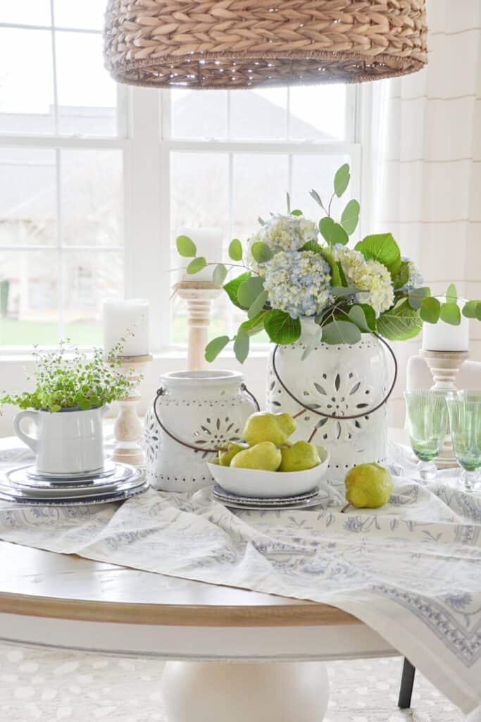 dining table centerpiece ideas with hydrangeas candles dishes and layered table setting