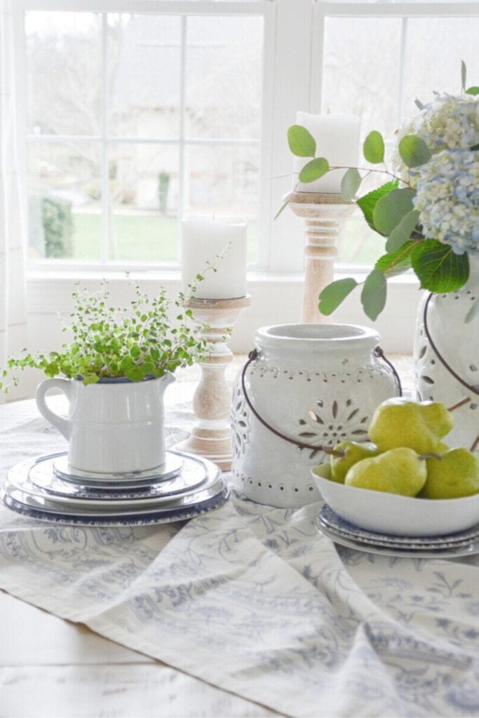 dining table centerpiece ideas using everyday items like dishes greenery and candles