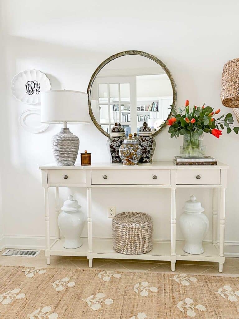 repeated ginger jars on a console table