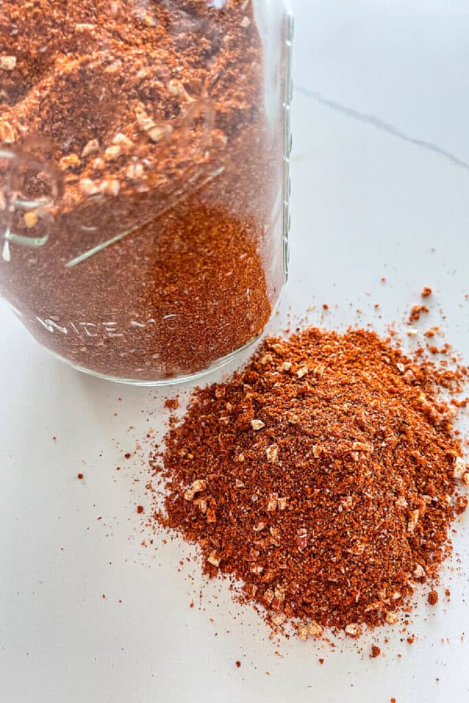 rub in a mason jar and a pile on a countertop