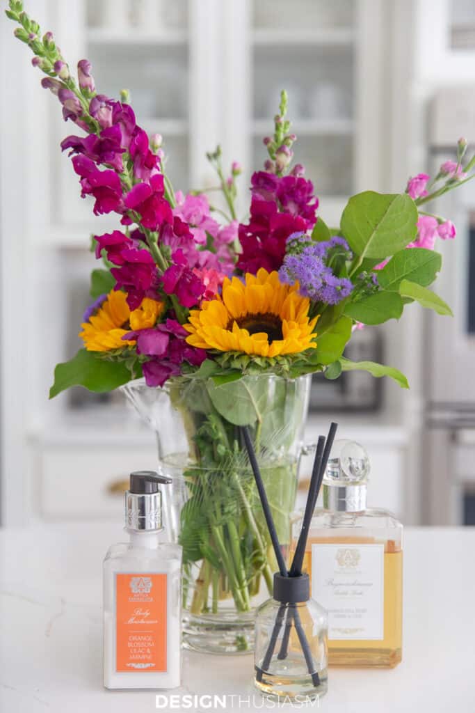 vase of flowers with toiletries