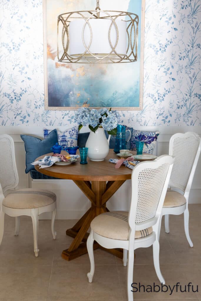 blue and white wall paper in a dining room