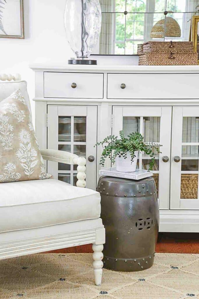 Spindle chair in front of a white buffet- study of dirty colors working together- mostly warm colors