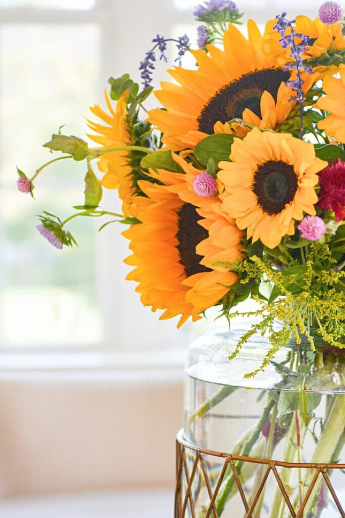 Sunflowers in a large glass vase