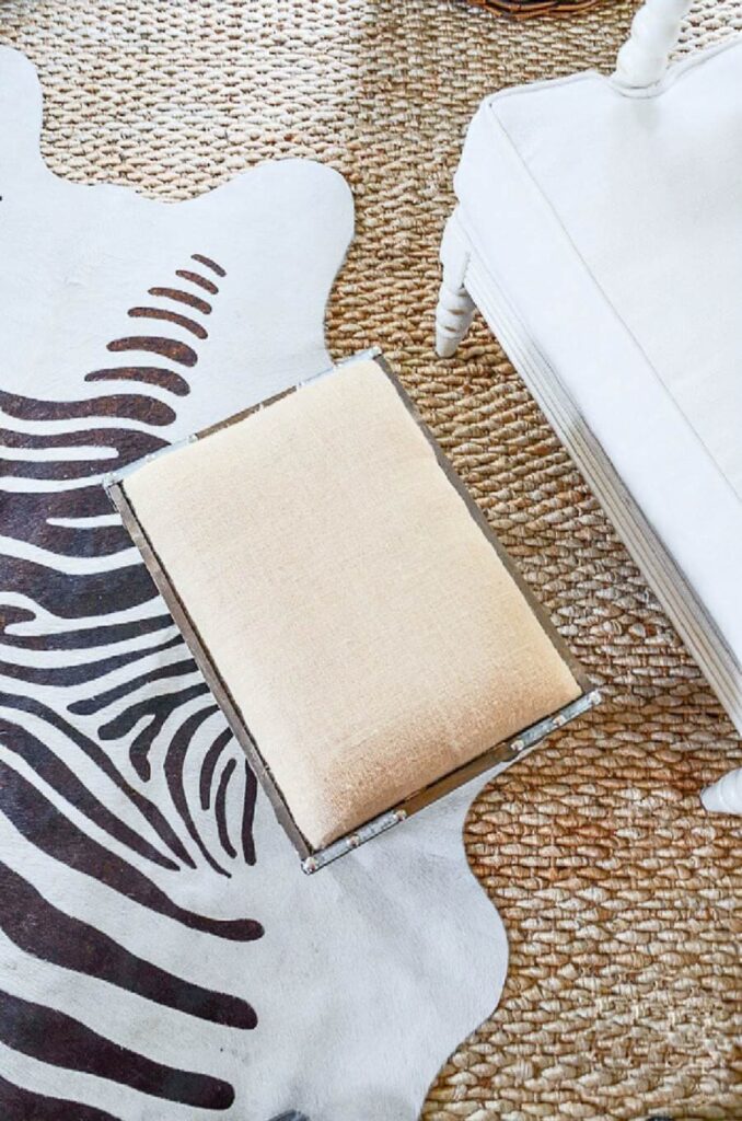 zebra rug over a sisal rug