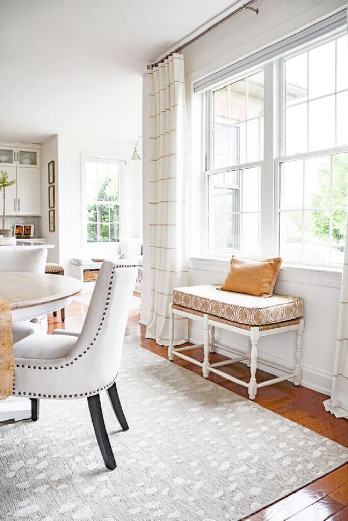 an upholstered bench in a dining room