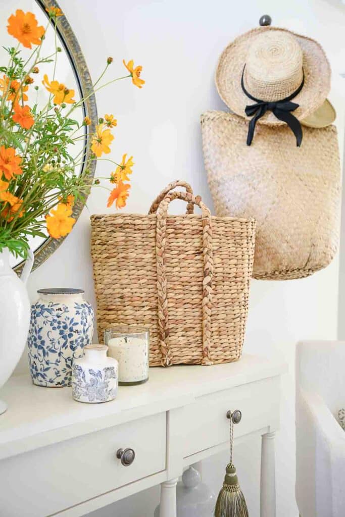 basket and hats hanging on a hook in the foyer