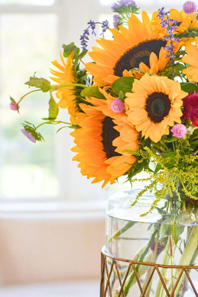 Sunflower arrangement in a glass vase for late summer decorating