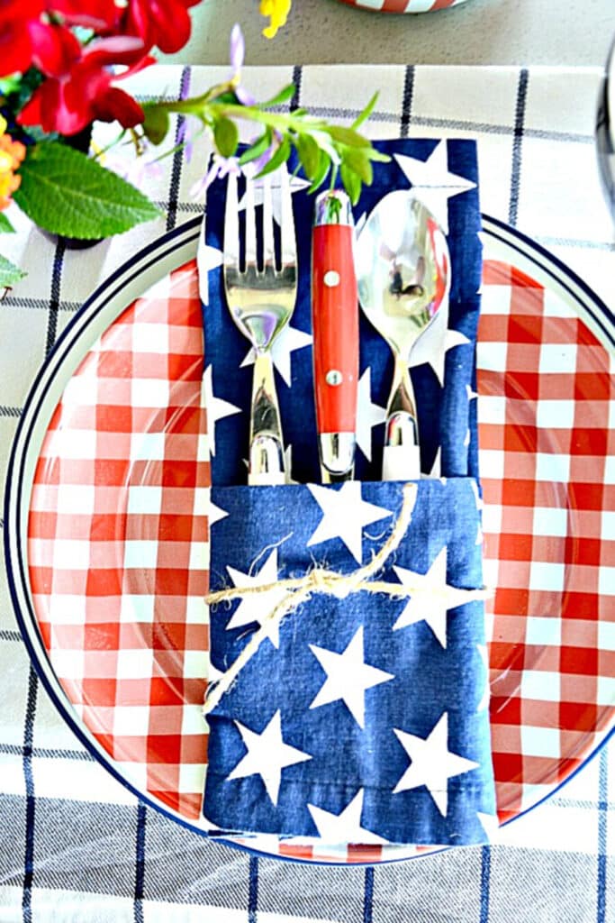 red, white and blue place setting with pocket fold napkin.