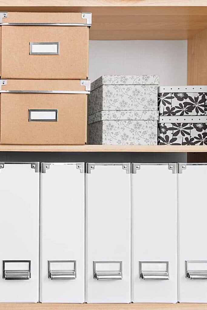 file folders and boxes neatly arranged on a shelf