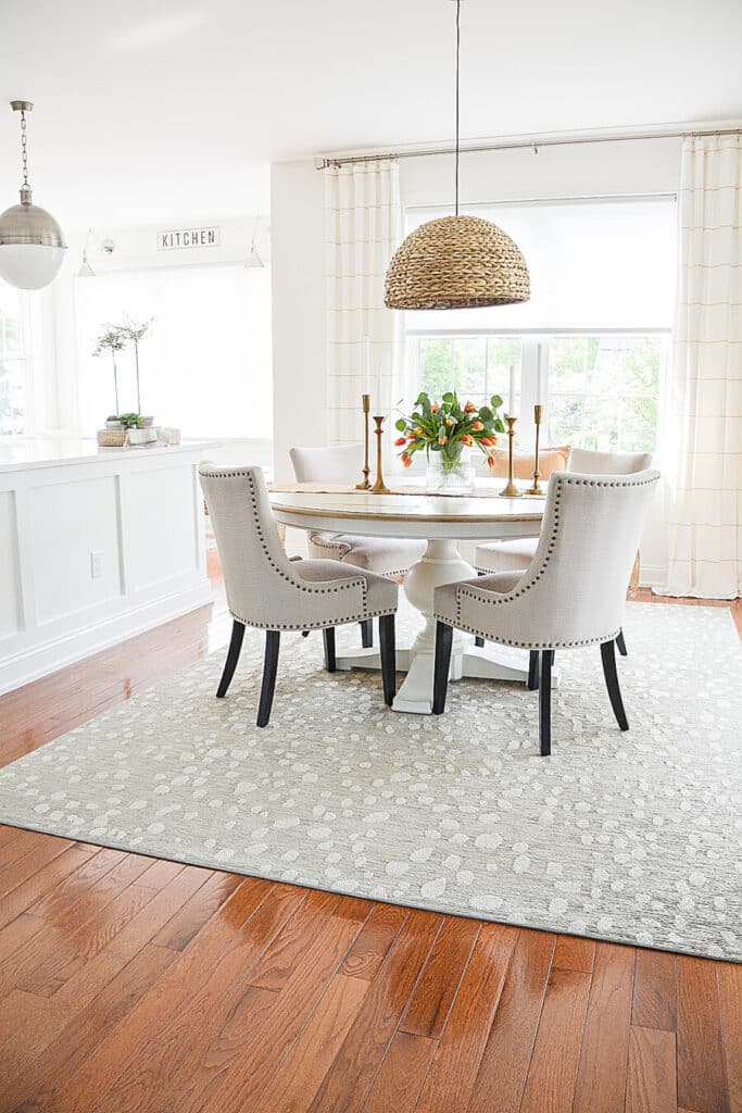 small dining room-long shot of table, chairs and rug