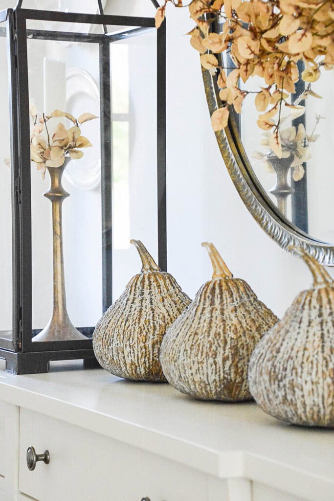 GOLDEN GOURDS ON A FOYER TABLE