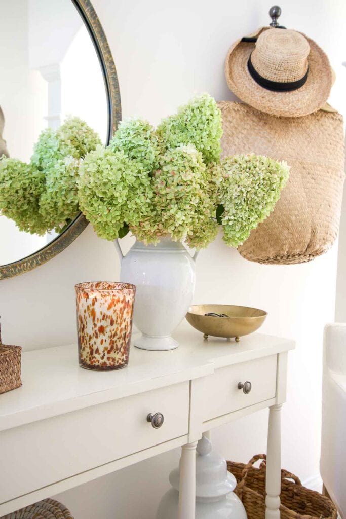 FOYER TABLE WITH GREEN DRYING HYDRANGEAS