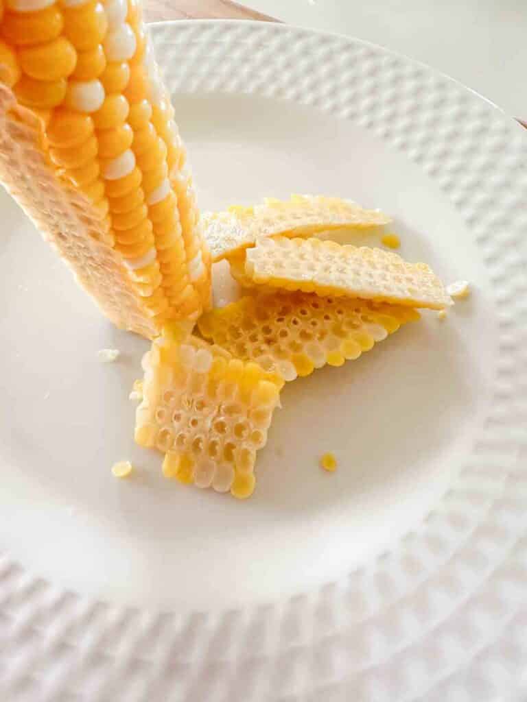 taking corn off the cob