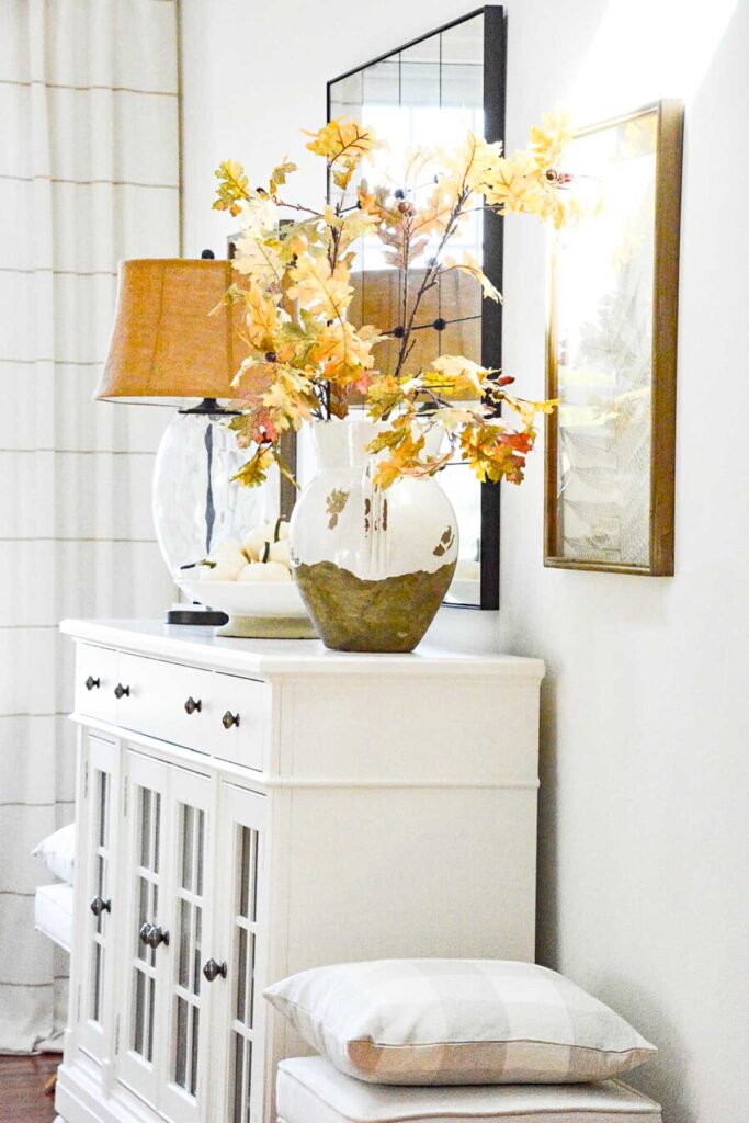 Urn of fall leaves on the white buffet- planning for fall and decorating