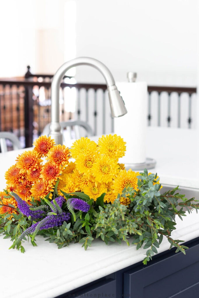 fall flowers in a kitchen sink