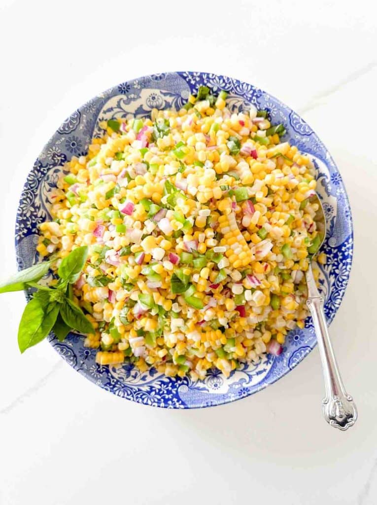 corn salad in blue and white bowl