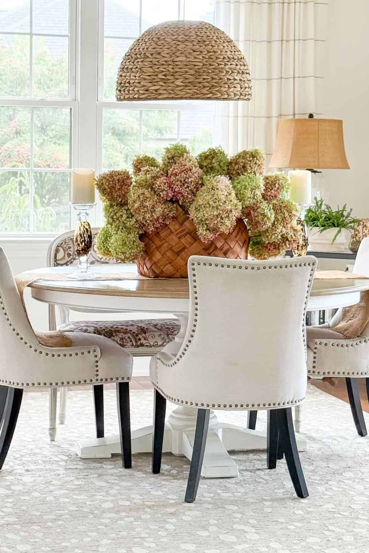 fall- drying hydrangeas in a basket on a dining room table