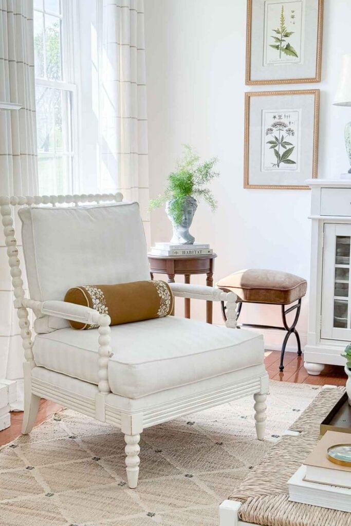 fall- gold bolster pillow on a spindle chair in the living room
