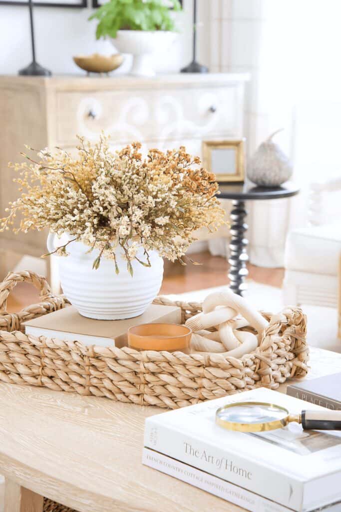 fall vignette with vase of dried organice on a coffee table