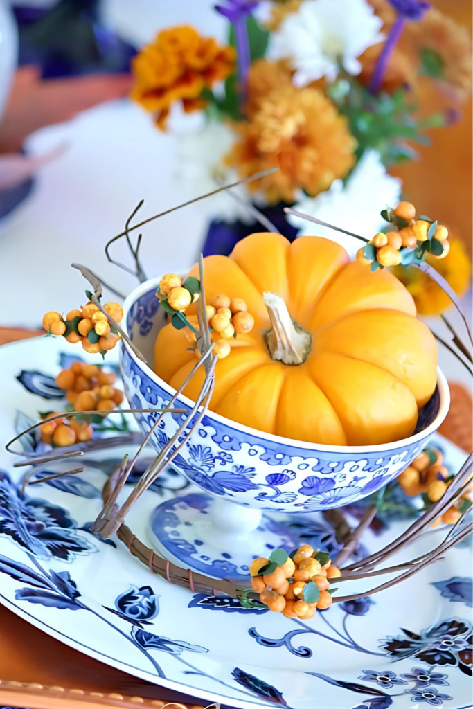 orange pumpkin in a chinoiserie footed bowl