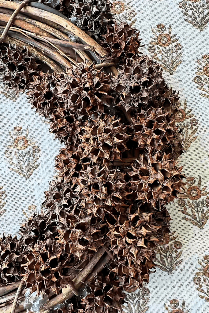 SWEET GUM BALLS IN THE TOP OF A WREATH