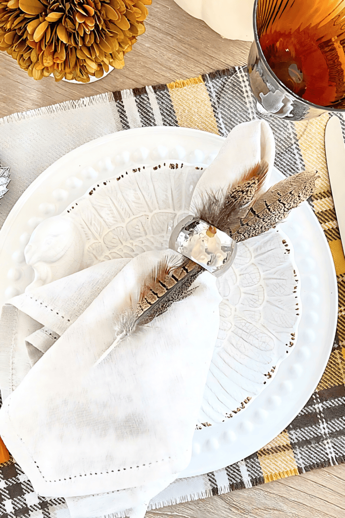 white place setting the a plaid placemat