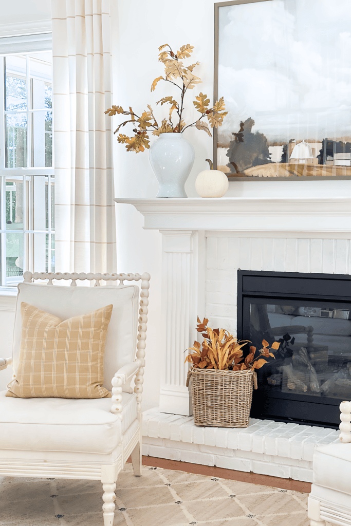 mantel with artwork and fall decor