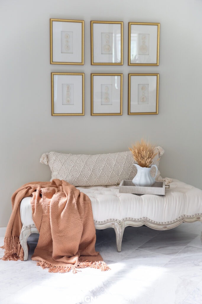 love seat with a gallery of pictures above