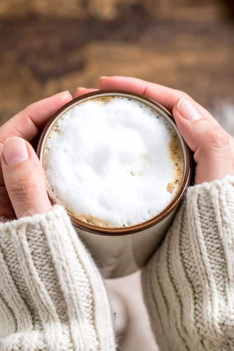 woman holding a cup of coffee