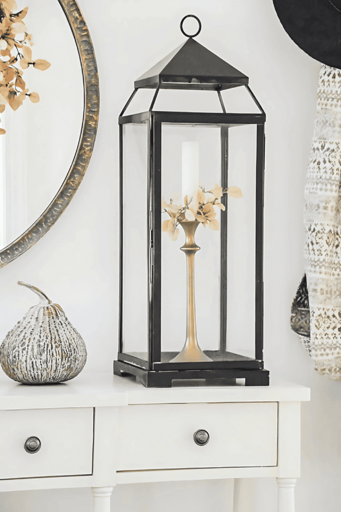 Black lantern with candlestick and fall leaf detail for easy fall decor