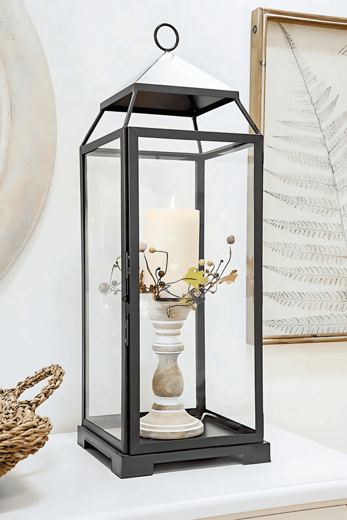 Black lantern with candlestick and fall leaf detail for easy fall decor