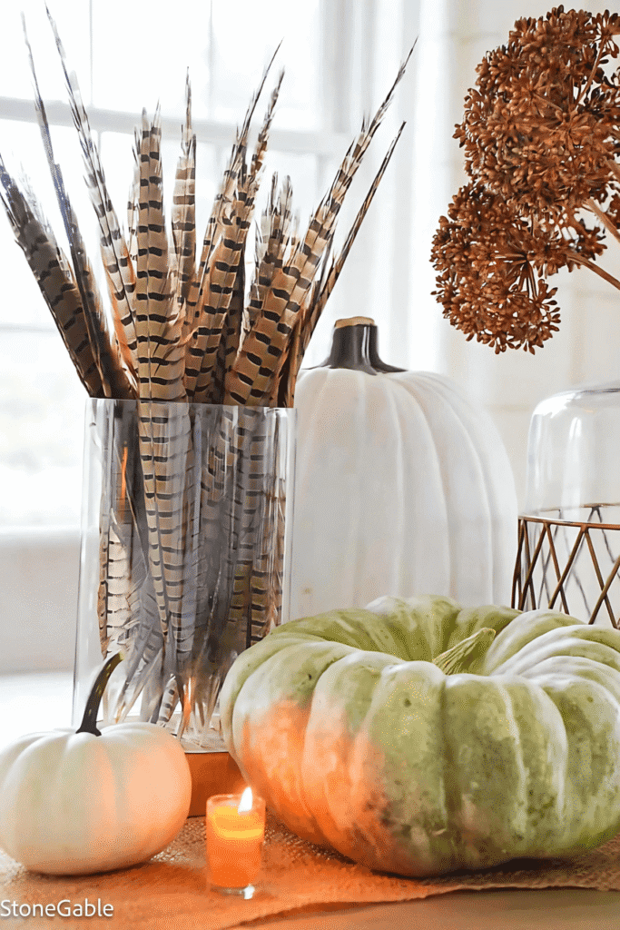 Tall pheasant feathers arranged in a clear glass cylinder