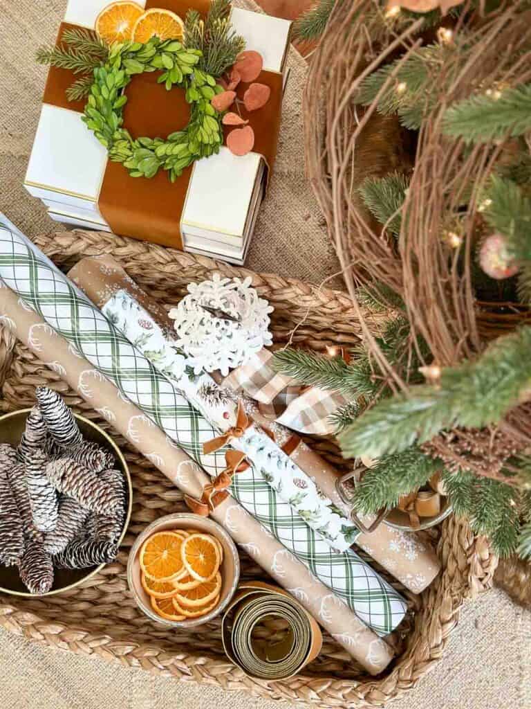 Christmas gift wrap and a package with ribbon and a wreath