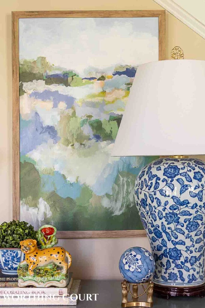 abstract art in back of a chinoiserie lamp