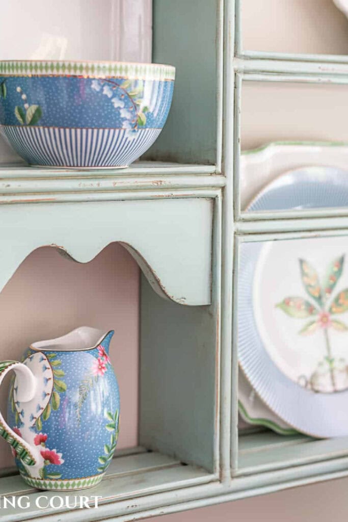plate rack with blue, white and green dishes