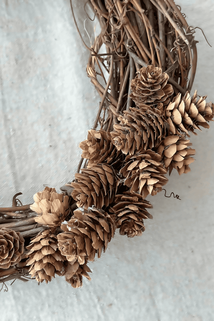 ADDING PINECONES TO THE MINI PINECONE WREATH