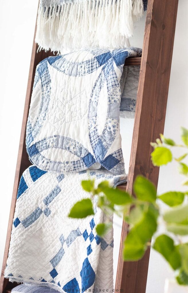 ladder with blue and white quilts