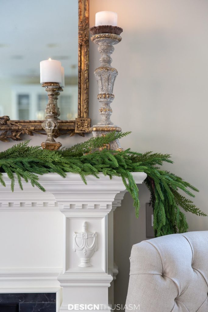 candlesticks on a Christmas mantel