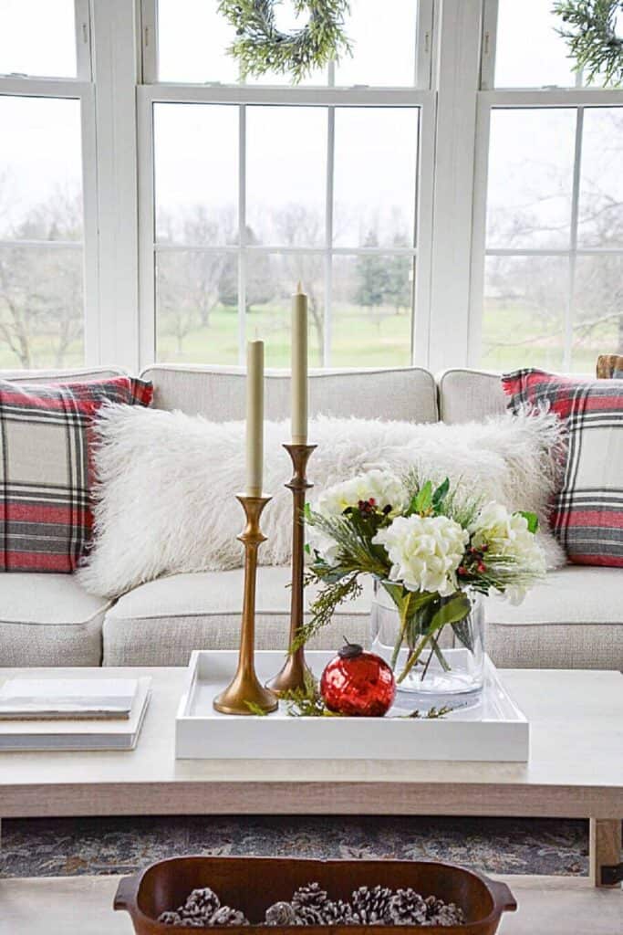 coffee table decorated for Chrstmas in a small sunroom