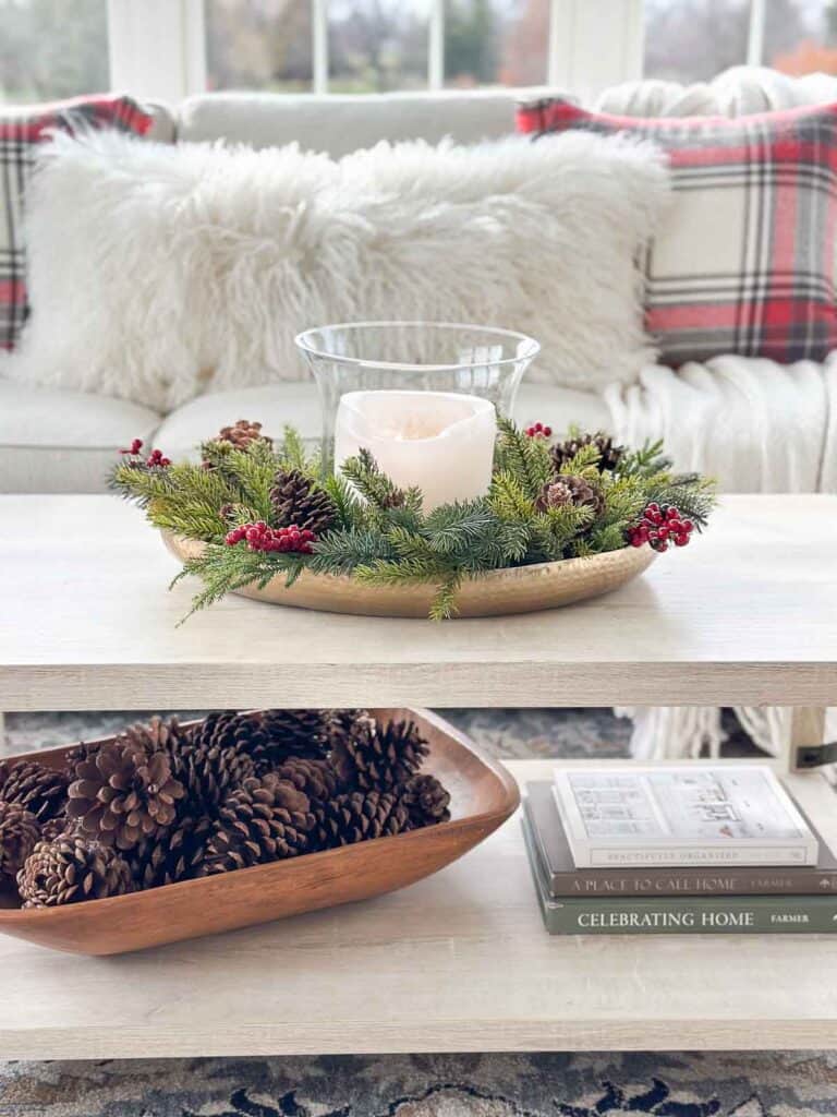 Christmas arrangement with greens and a candle